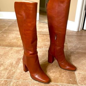 Tall leather boots, never worn